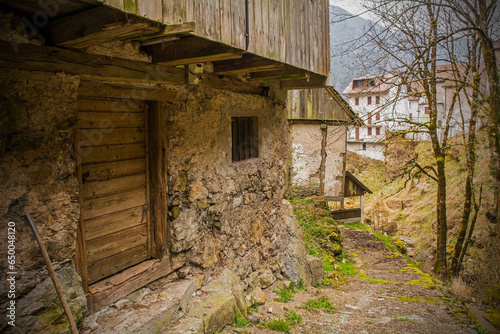 An old derelict building in the historic mountain village of Rigolato in Carnia, Friuli-Venezia Giulia,  North East Italy photo