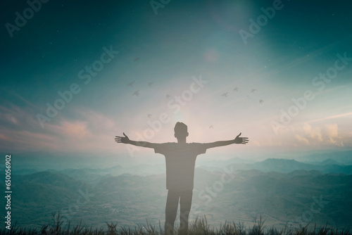 Happy man rise hand on morning view. Christian inspire praise God on good friday background. Now one man self confidence on peak open arms enjoying nature the sun concept world wisdom fun hope.