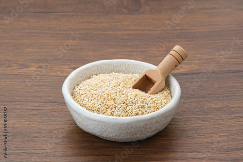 Organic White Sesame Seeds (Sesamum indicum) or Wijen, served in small bowl on wooden background
 photo