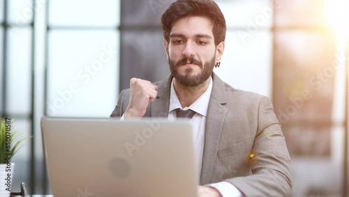 celebrating goal achievement winning online getting good news in email raising hands feeling euphoric.