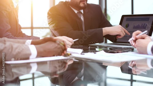 business and office concept - close up of business team with graph on tablet pc screen and coffee in office