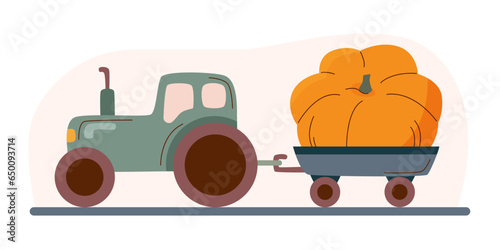 A tractor with a trailed cart with a large pumpkin in it. Thanksgiving concept, harvest concept.
