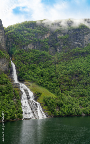 Beautiful waterfall called The Suitor which is opposite the Seven Sisters waterfalls in Geiranger Fjord, Norway