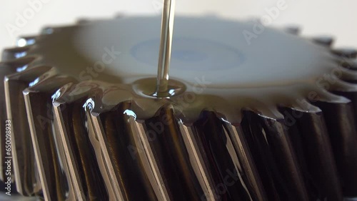 Wallpaper Mural Pouring motor oil in to a gear Torontodigital.ca