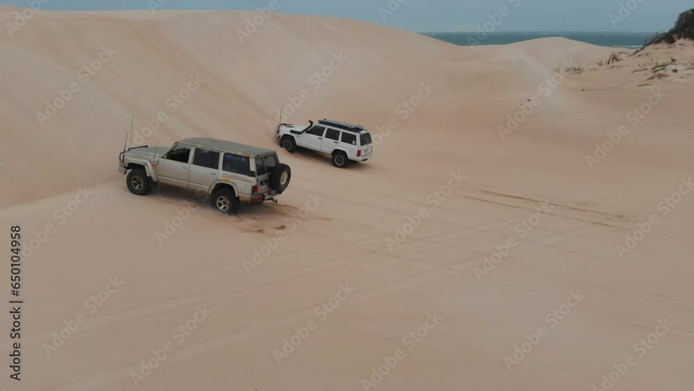 Cars are driving on dunes and get stuck at Geraldton western australia, aerial Cars are driving on dunes and get stuck at Geraldton western australia, aerial