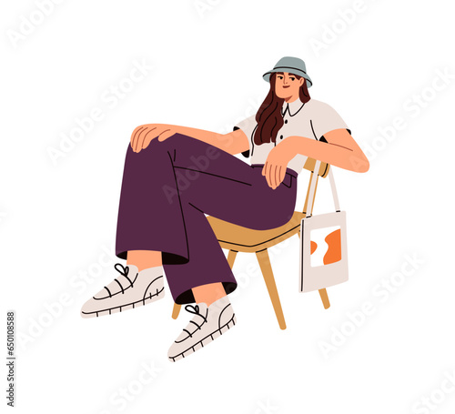 Modern young woman sitting in chair, posing in trendy outfit. Happy stylish girl in fashion casual clothes, wearing panama and sneakers. Flat vector illustration isolated on white background