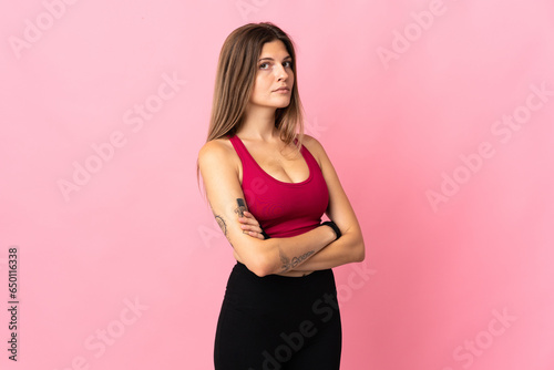 Young slovak woman isolated on pink background keeping the arms crossed