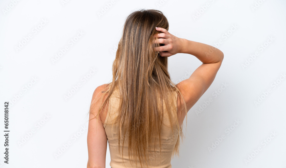 Young caucasian woman isolated on white background in back position and thinking Young caucasian woman isolated on white background in back position and thinking
