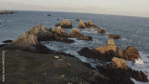 Sunrise in Ouessant/Ushant, Bretagne, France. Huge rock formations in the background. photo