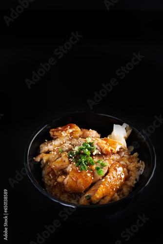 Grilled Chicken teriyaki rice Japanese food isolated in black background