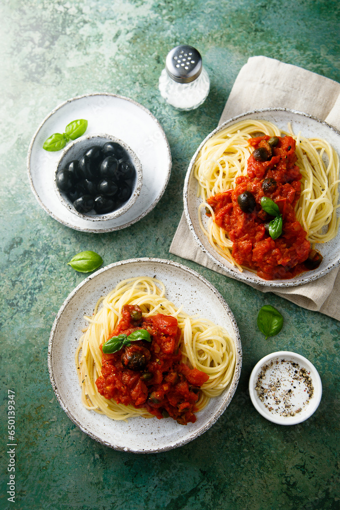 Traditional pasta with tomatoes, olives and anchovy Traditional pasta with tomatoes, olives and anchovy