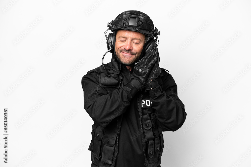Middle age SWAT man isolated on white background making sleep gesture in dorable expression
