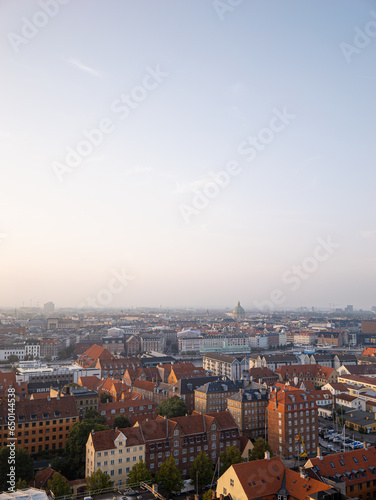 Aerial drone shot of the cityscape of Copenhagen, Denmark during sunset