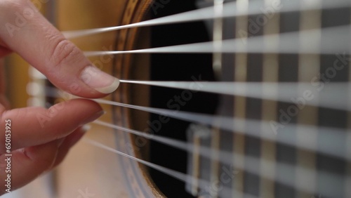 Female Guitarist Playing Song on Classical Guitar Close Up
