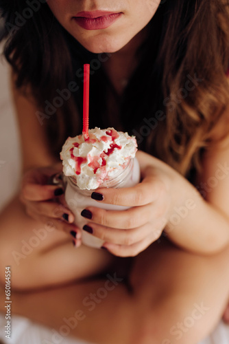 Lady holding glass with tasty drink
