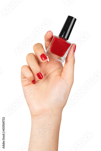 Female hand holding red nail polish on isolated background.