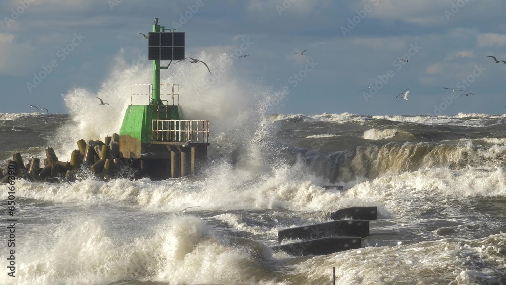 Waves Hit Concrete Breakwater Shore and Lighthouse In Heavy Storm Slow Motion