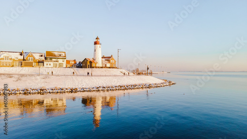 Lighthhouse of Urk Netherlands during sunset in the Netherlands photo