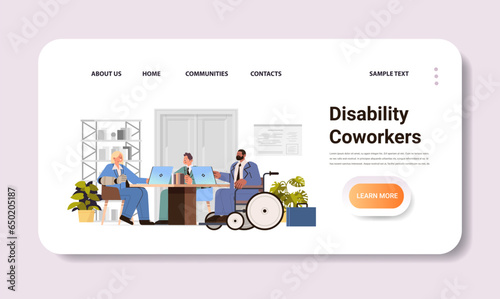 disabled businessman in wheelchair discussing with coworkers in office disability employment people with disabilities concept