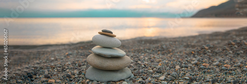 Canvas Print stack of zen stones on pebble beach