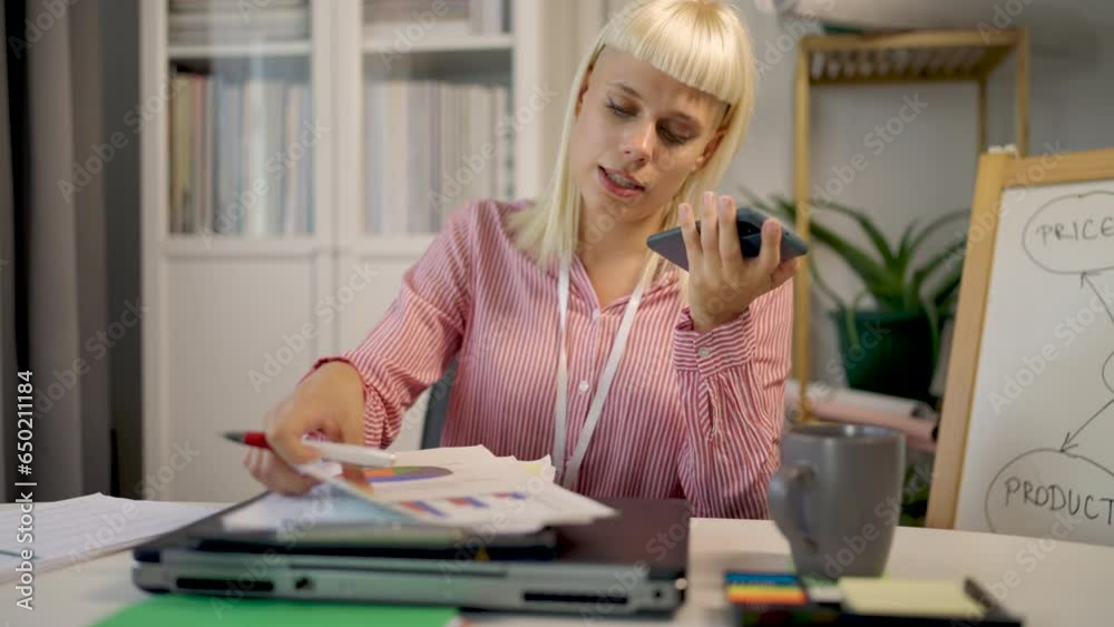 Young blonde woman working on her laptop and make voice call Young blonde woman working on her laptop and make voice call