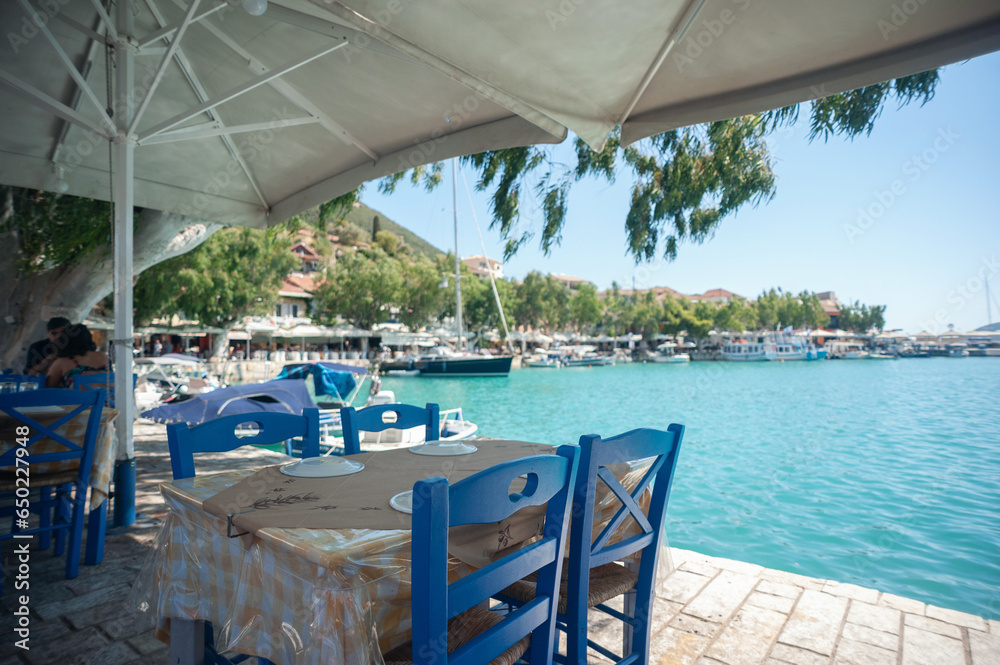 A cute restaurant table by the sea in Greece A cute restaurant table by the sea in Greece