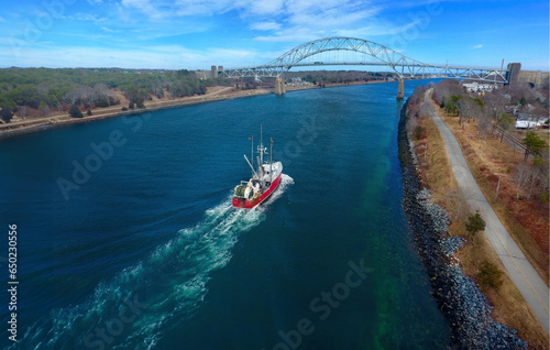 Sagamore Bridge at the Cape Cod Canal with Traffic and Boats in Massachusetts photo