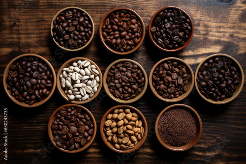 top view of different varieties mixture of coffee beans on a wooden table