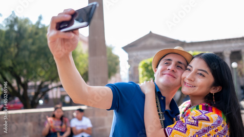 Couple in love take a selfie and smile. photo