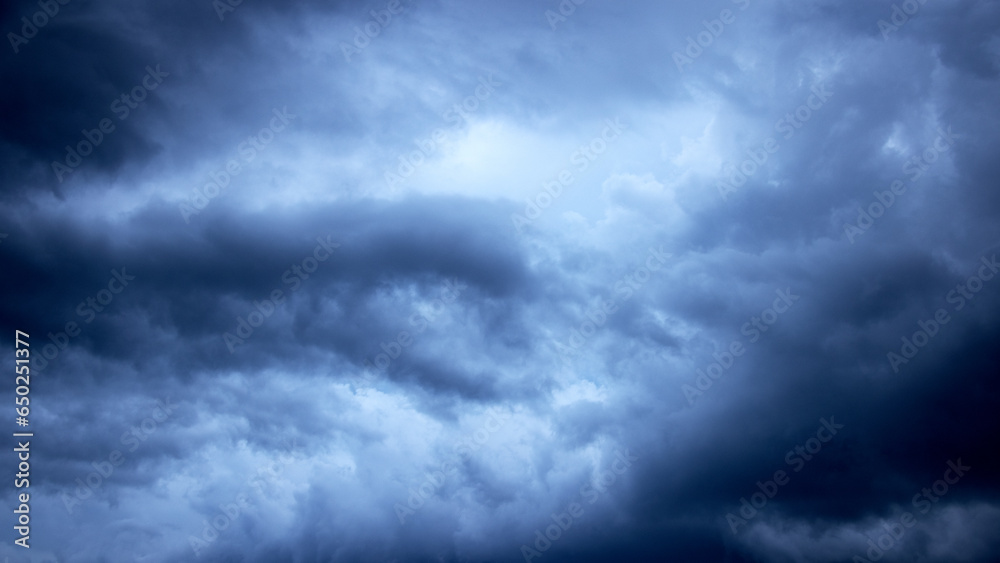 Dramatic sky background. Stormy clouds in the dark sky. Panoramic image can be used as a web banner or wide site header. Dramatic sky background. Stormy clouds in the dark sky. Panoramic image can be used as a web banner or wide site header.