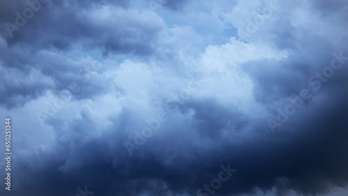 Dramatic sky background. Stormy clouds in the dark sky. Panoramic image can be used as a web banner or wide site header.