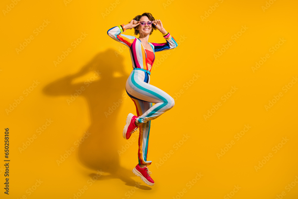 Photo of cheerful lady jumping celebrate festive event occasion isolated bright color background
