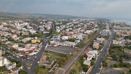 Aerial photo of an isolated road where cars pass. City landscape