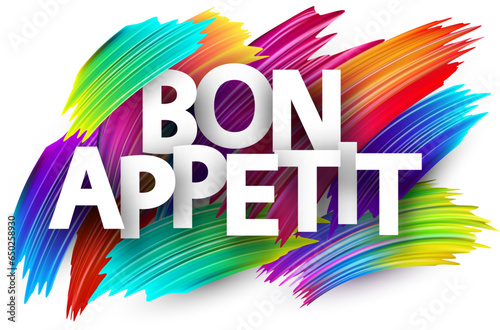 Enjoy your meal paper word sign with colorful spectrum paint brush strokes over white.