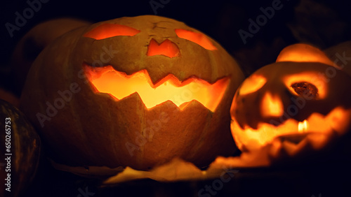 Halloween pumpkin with glowing eyes. Mystical still life.