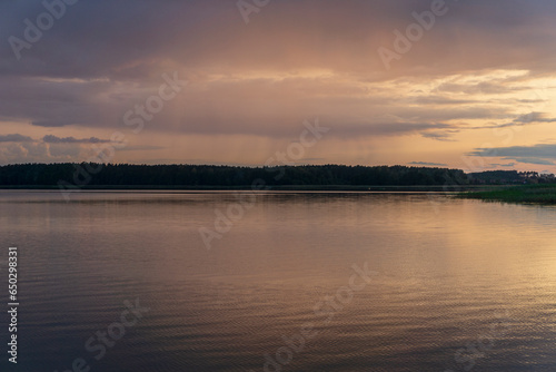 Fototapeta Naklejka Na Ścianę i Meble -  Beautiful summer sunset over the lake.