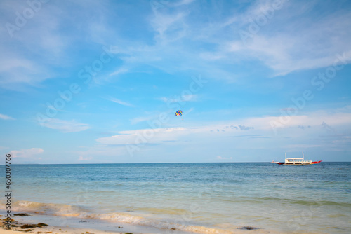 Beautiful beach with blue waters, white sand and clear sky at Alona Beach, Bohol, Philippines. photo