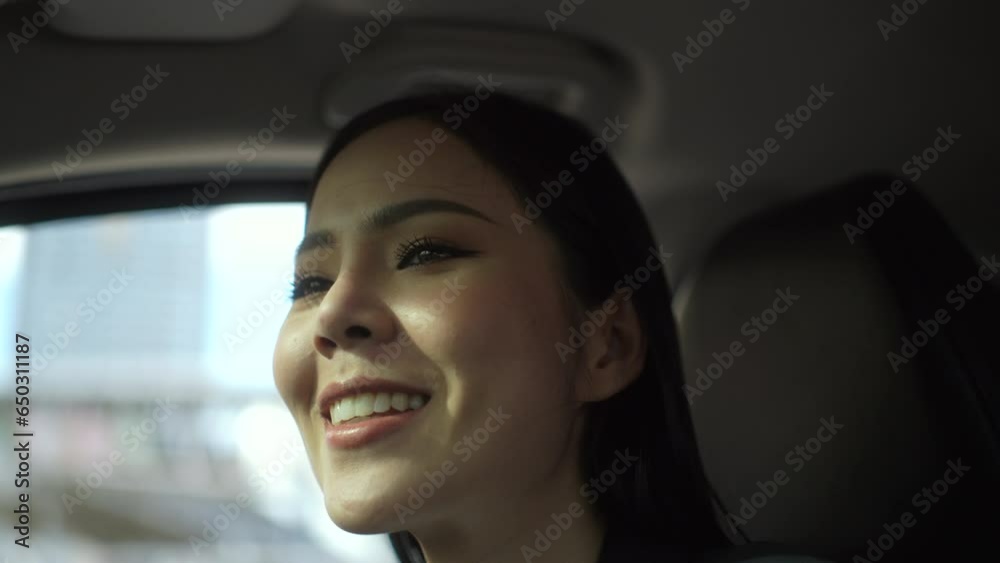 Happy feeling beautiful asian business woman looking roadway while driving car to office. Woman sitting in car was feeling proud and very happy. Buy sell rent car concept. Happy feeling beautiful asian business woman looking roadway while driving car to office. Woman sitting in car was feeling proud and very happy. Buy sell rent car concept.