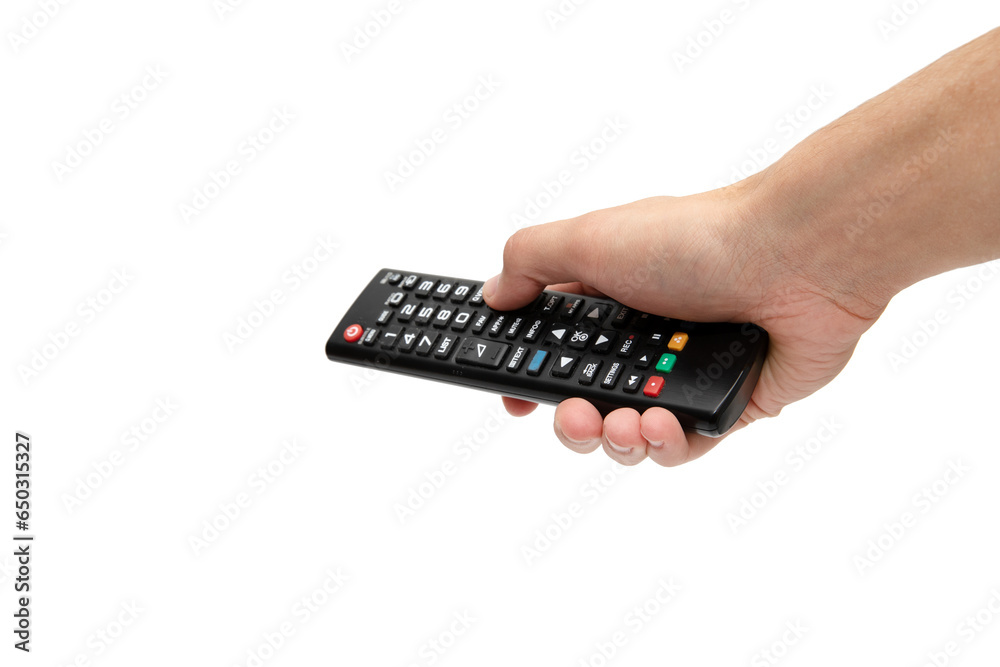 A person holds a remote control in his hands to switch channels on the TV. Remote control in hand isolated on a white background A person holds a remote control in his hands to switch channels on the TV. Remote control in hand isolated on a white background