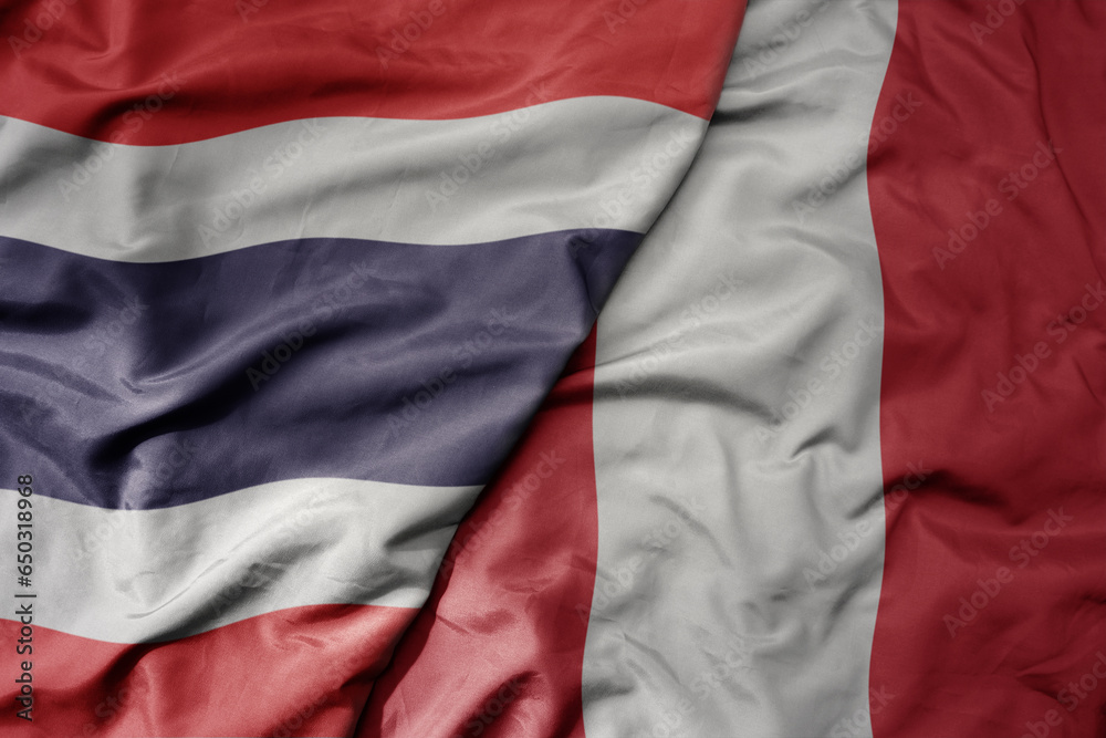 big waving national colorful flag of thailand and national flag of paraguay . big waving national colorful flag of thailand and national flag of paraguay .