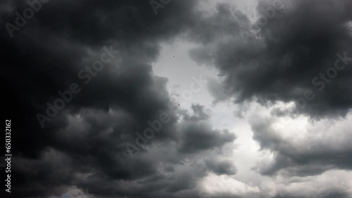 Clouds float across the blue sky and turn into thunderclouds. Summer sky before the rain, during the rain. time interval. 4k