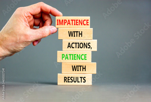 Action and result symbol. Concept words Impatience with actions patience with results on wooden block. Beautiful grey table grey background. Businessman hand. Business action result concept. photo