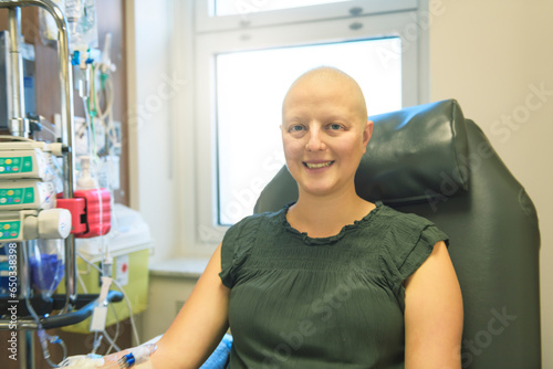 Young woman in hospital bed suffering from breast cancer receiving treatment photo