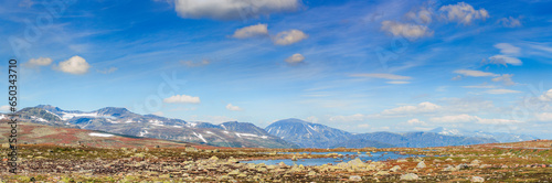 Mountain panorama with lake in Jotunheimen national park in Norway, Europe photo