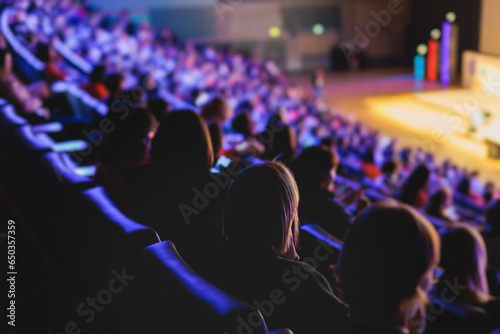 Canvastavla Audience at the modern conference hall listens to panel discussion, people on a