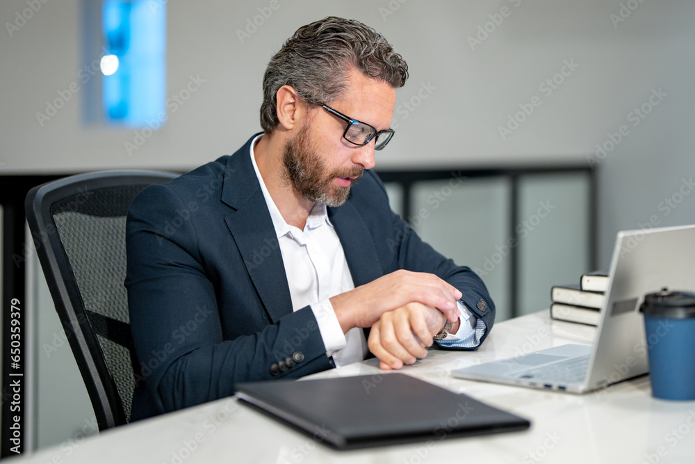 Office worker with laptop at office. Ofice employee remote working in modern office. Businessman on remote meeting, working online in offices place. Business man using computer in office. Office worker with laptop at office. Ofice employee remote working in modern office. Businessman on remote meeting, working online in offices place. Business man using computer in office.