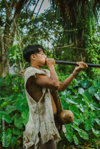 Tribal man hunting with blowgun photo