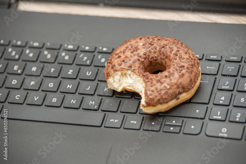 Doughnut on a Keyboard. When you must do a lot of work and have no time for break, eating a doughnut off a laptop keyboard is also a viable break option.