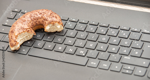 Doughnut on a Keyboard. When you must do a lot of work and have no time for break, eating a doughnut off a laptop keyboard is also a viable break option.