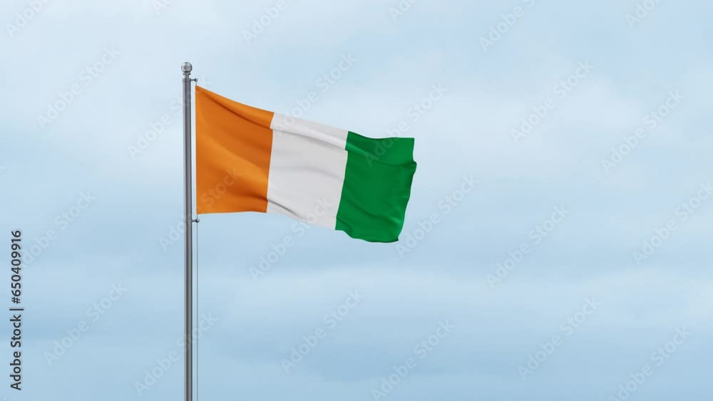 Ivory Coast or Cote d'Ivoire flag waving in the wind, cloudy blue sky with running clouds, endless seamless loop